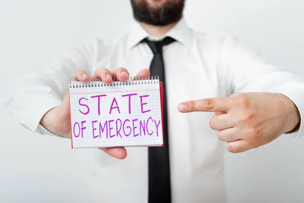 Writing note showing State Of Emergency. Business photo showcasing acknowledging an extreme condition affecting at a national level Model displaying different empty color notepad mock-up for writing