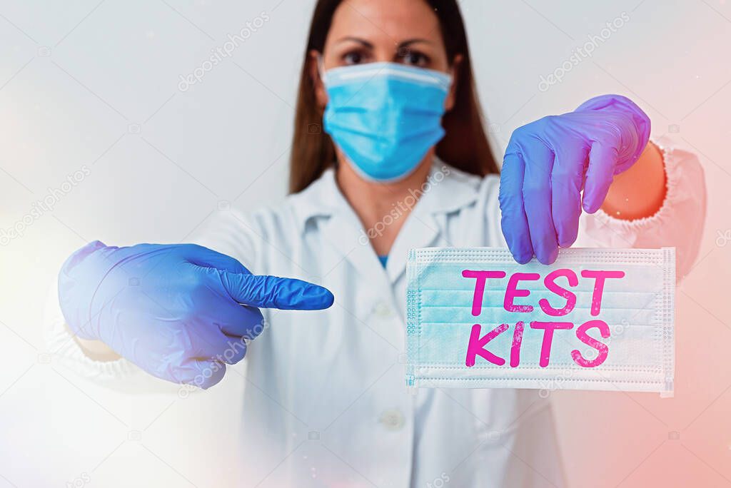 Writing note showing Test Kits. Business photo showcasing tools used to detect the presence of something in the body Laboratory blood test sample for medical diagnostic analysis.