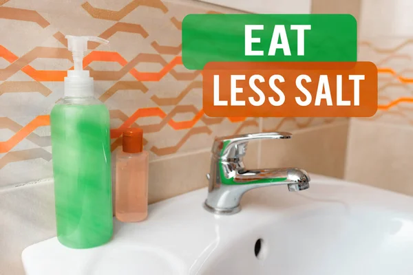 Handwriting text writing Eat Less Salt. Concept meaning reducing the sodium intake on the food and beverages Handwashing procedures for decontamination and minimizing bacterial growth.