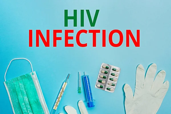 Text sign showing Hiv Infection. Conceptual photo A disease of the immune system due to the infection of HIV Primary medical precautionary equipments for health care protection.