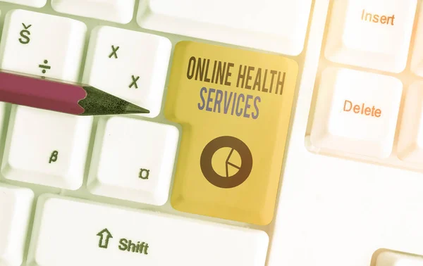 Conceptual hand writing showing Online Health Services. Business photo showcasing healthcare delivered and enhanced through the internet Colored keyboard key with accessories arranged on copy space. — Stock Photo, Image