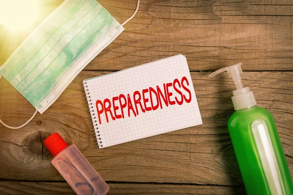 Handwriting text writing Preparedness. Concept meaning quality or state of being prepared in case of unexpected events Set of medical equipment with notepad for health condition assessment. — Stock Photo, Image