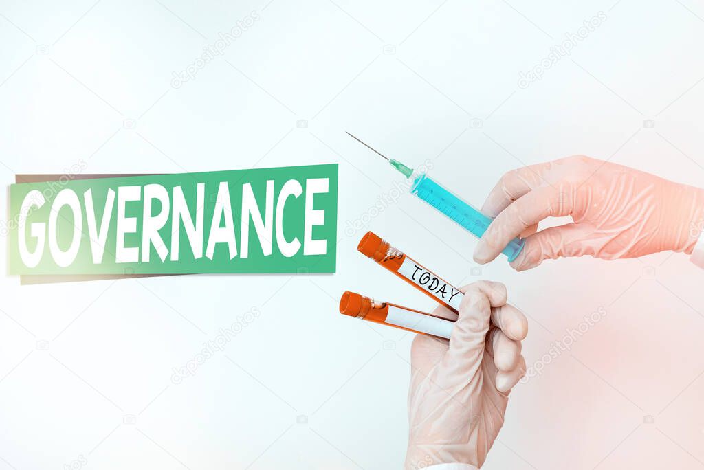 Word writing text Governance. Business concept for exercised in handling an economic situation in a nation Extracted blood sample vial ready for medical diagnostic examination.