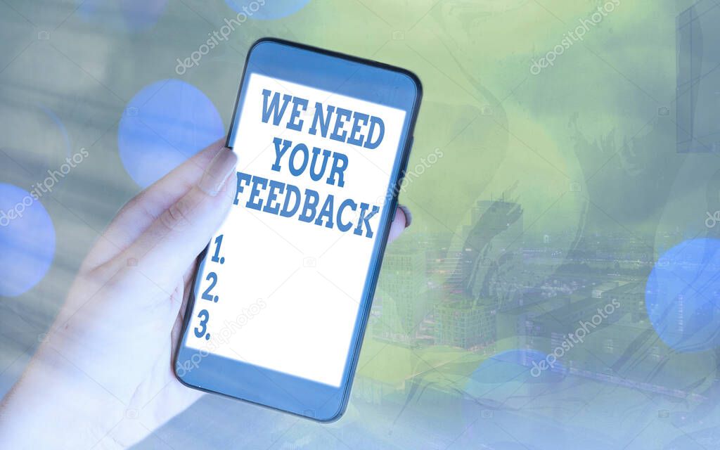 Handwriting text We Need Your Feedback. Concept meaning Give us your ideas and suggestions on what to improve Modern gadgets with white display screen under colorful bokeh background.