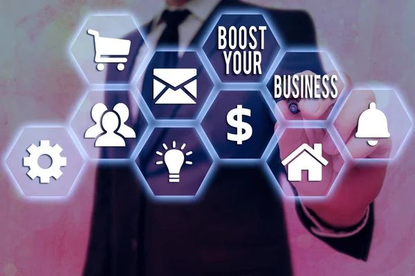 Conceptual hand writing showing Boost Your Business. Business photo text Suitable for web Landing page, web page design to increase profit Grids and different icons latest digital technology concept.