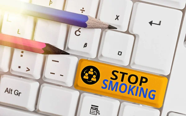 Conceptual hand writing showing Stop Smoking. Business photo text the process of discontinuing or quitting tobacco smoking Colored keyboard key with accessories arranged on empty copy space. — Stock Photo, Image