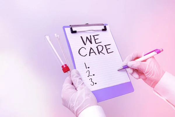 Handwriting text We Care. Concept meaning Cherishing someones life Giving care and providing their needs Laboratory blood test sample shown for medical diagnostic analysis result.