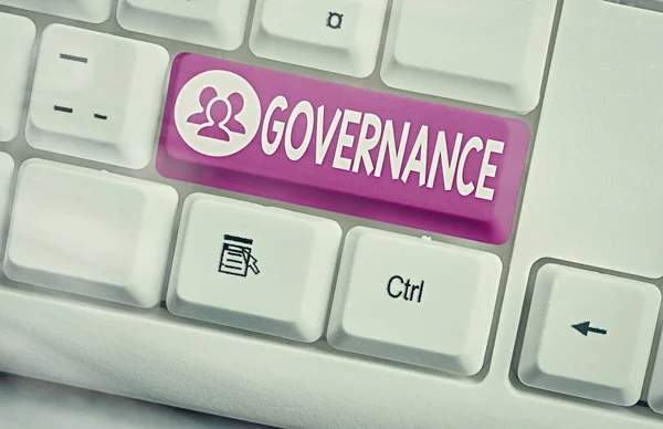 Handwriting text Governance. Concept meaning exercised in handling an economic situation in a nation Different colored keyboard key with accessories arranged on empty copy space. — Stock Photo, Image