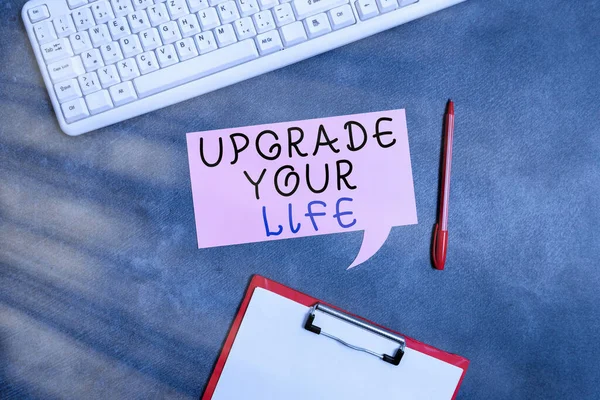 Conceptual hand writing showing Upgrade Your Life. Business photo text improve your way of living Getting wealthier and happier Paper accessories with smartphone arranged on different background.