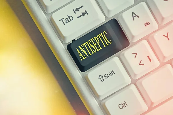 Conceptual hand writing showing Antiseptic. Business photo showcasing antimicrobial agents that delays or completely eliminate microorganism Colored keyboard key with accessories arranged on copy — Stock Photo, Image