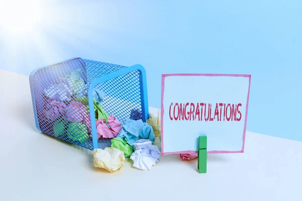 Word writing text Congratulations. Business concept for a special occasion that expressing gratitude or good wishes Trash bin crumpled paper clothespin empty reminder office supplies tipped.