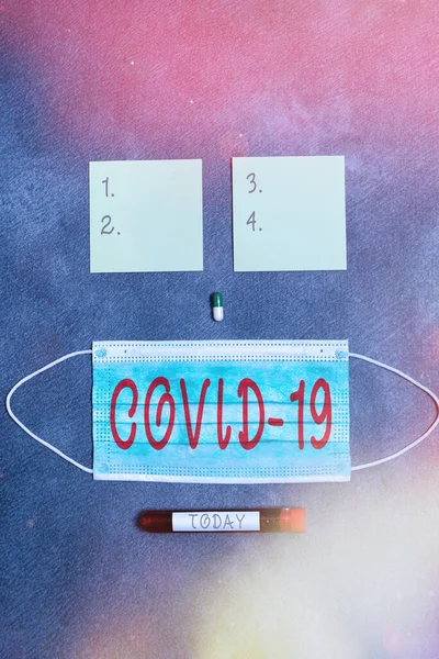 Conceptual hand writing showing Covid19. Business photo text mild to severe respiratory illness that is caused by a coronavirus Set of medical equipment for health condition assessment. — Stock Photo, Image