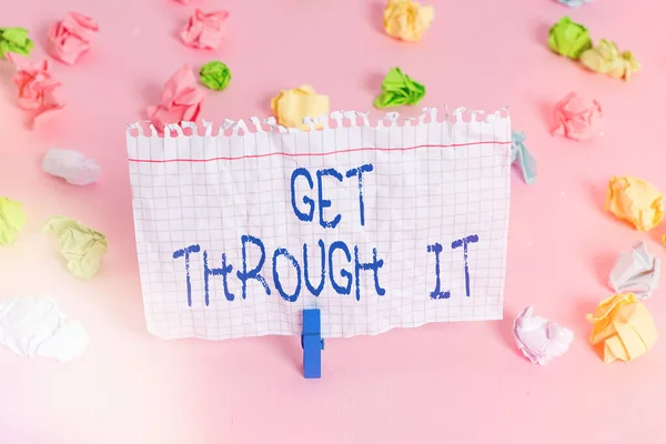 Conceptual hand writing showing Get Through It. Business photo showcasing encourage someone to succeed in passing or surviving Colored crumpled papers empty reminder pink floor clothespin. — Stock Photo, Image