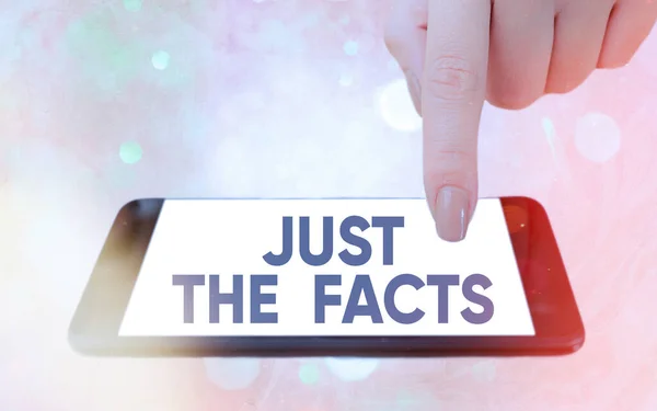 Text sign showing Just The Facts. Conceptual photo to have the correct information about the exact details Modern gadgets with white display screen under colorful bokeh background. — Stock Photo, Image