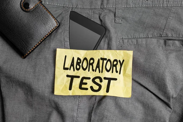 Writing note showing Laboratory Test. Business photo showcasing Determination of a medical diagnosis from the substances tested Smartphone device inside trousers front pocket with wallet.