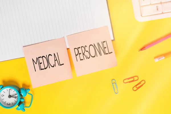 Handwriting text Medical Personnel. Concept meaning trusted healthcare service provider allowed to treat illness Flat lay above table with blank papers with copy space for text messages.