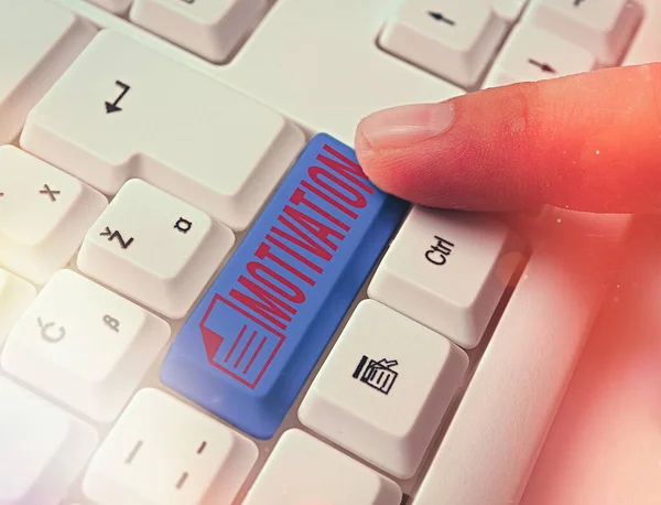 Writing note showing Motivation. Business photo showcasing reasons one has for acting or behaving in a particular way White pc keyboard with empty note paper above white key copy space.