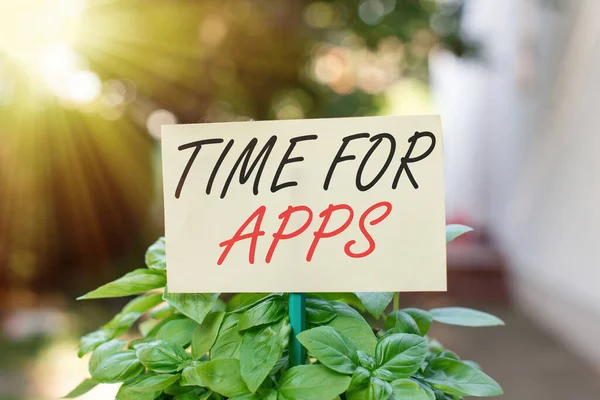 Handwriting text writing Time For Apps. Concept meaning make use of application or services using the technologies Plain empty paper attached to a stick and placed in the green leafy plants. — Stock Photo, Image