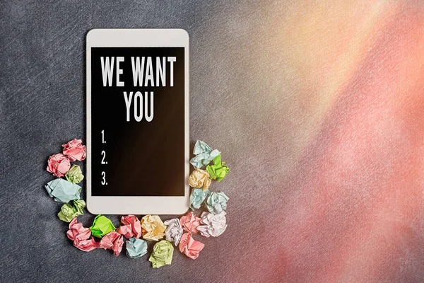 Text sign showing We Want You. Conceptual photo having a desire or would like an individual to do something Paper accesories with digital smartphone arranged on different background.