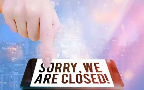 Writing note showing Sorry, We Are Closed. Business photo showcasing apologize for shutting off business for specific time Modern gadgets white screen under colorful bokeh background. — Stock Photo, Image