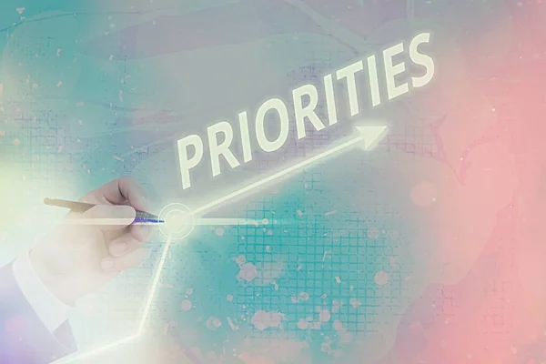 Word writing text Priorities. Business concept for more important is the fact or state of being viewed or handled Arrow symbol going upward denoting points showing significant achievement. — Stock Photo, Image