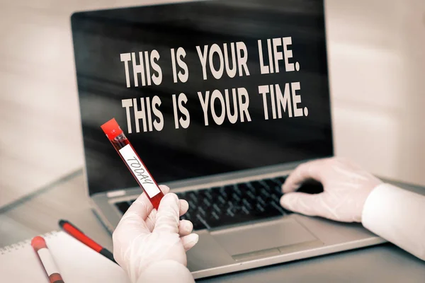 Handwriting text This Is Your Life. This Is Your Time.. Concept meaning do whatever you think pleases you Extracted blood sample vial with lastest technology ready for examination.