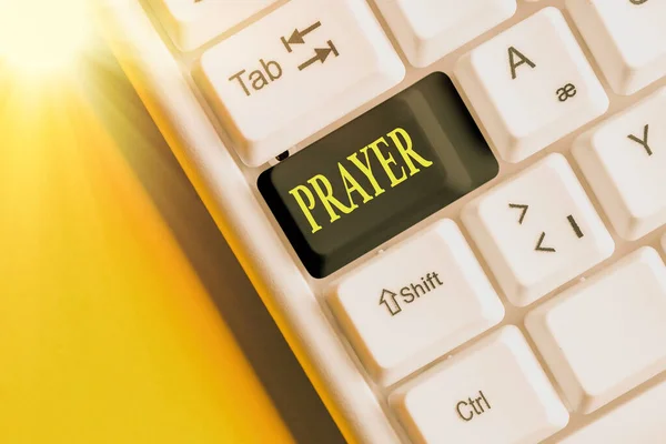 Conceptual hand writing showing Prayer. Business photo showcasing solemn request for help or expression of thanks addressed to God Colored keyboard key with accessories arranged on copy space. — Stock Photo, Image