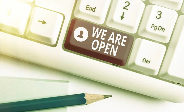 Writing note showing We Are Open. Business photo showcasing no enclosing or confining barrier, accessible on all sides Colored keyboard key with accessories arranged on empty copy space. — Stock Photo, Image