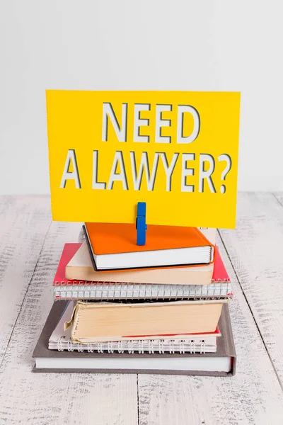 Conceptual hand writing showing Need A Lawyer Question. Business photo showcasing asking someone who needs legal issues and disputes pile stacked books notebook pin color reminder white wooden. — Stock Photo, Image