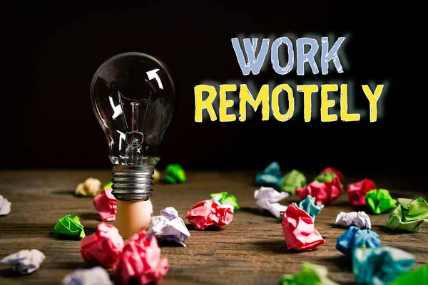 Writing note showing Work Remotely. Business photo showcasing fresh working style where employees handles job away from the public Realistic colored vintage light bulbs, idea sign solution.