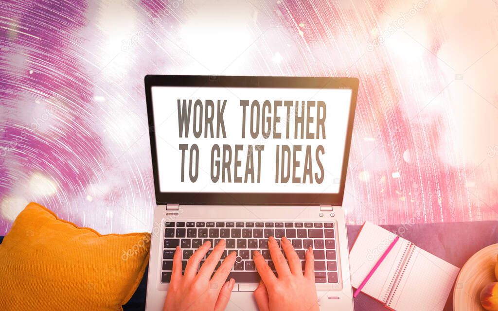 Handwriting text writing Work Together To Great Ideas. Concept meaning splitting up the work and getting it done Modern gadgets with white display screen under colorful bokeh background.