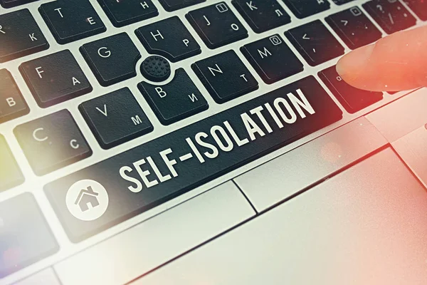Writing note showing Self Isolation. Business photo showcasing promoting infection control by avoiding contact with the public Pc keyboard key with pointing finger above background copy space.