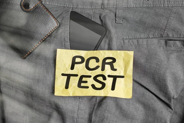 Note d'écriture montrant Pcr Test. Photo d'affaires montrant la détection qualitative du génome viral dans la courte séquence d'ADN Appareil smartphone à l'intérieur du pantalon poche avant avec portefeuille. — Photo