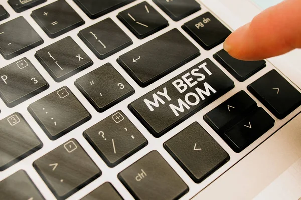 Text sign showing My Best Mom. Conceptual photo Appreciation for your mother s is love feelings compliment Pc keyboard key with pointing finger above background copy space. — Stock Photo, Image