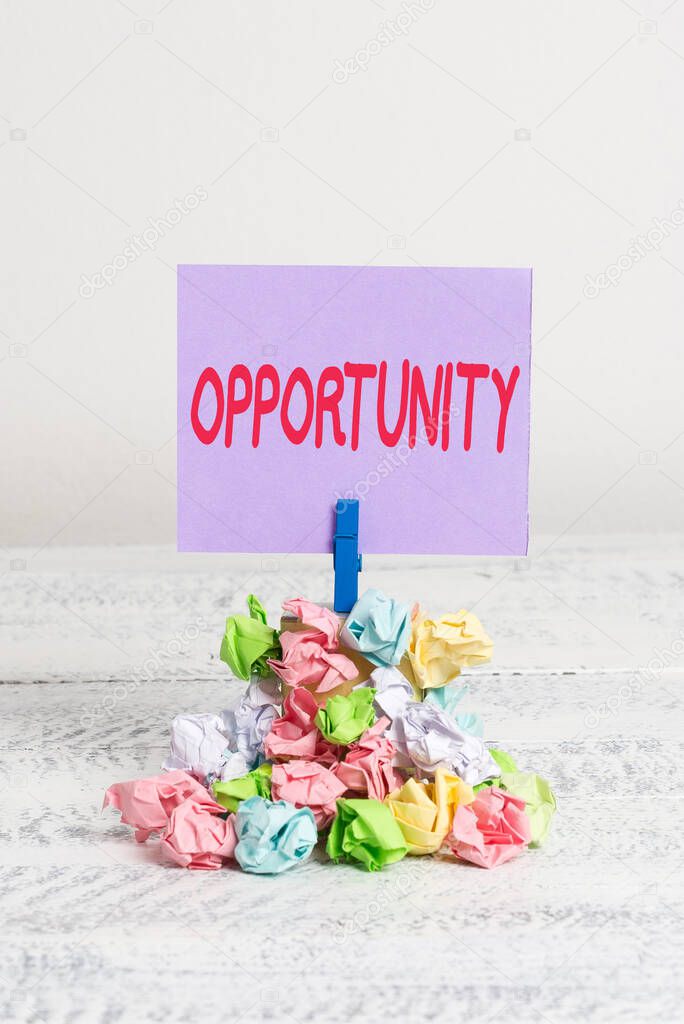 Word writing text Opportunity. Business concept for an opportunity allowing you to do something you want to do Reminder pile colored crumpled paper clothespin reminder white wooden space.