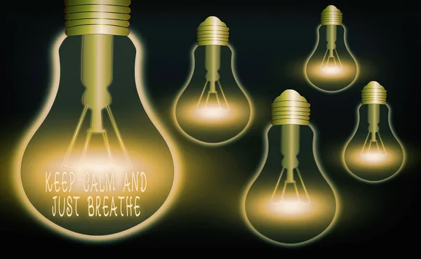 Handwriting text Keep Calm And Just Breathe. Concept meaning Take a break to overcome everyday difficulties Realistic colored vintage light bulbs, idea sign solution thinking concept.