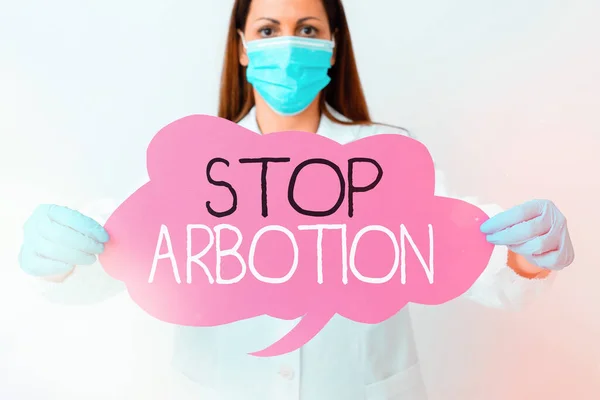 Palavra escrita texto Stop Arbotion. Conceito de negócio para advogar contra a prática do aborto Prolife movimento Laboratório técnico com adesivo vazio acessórios de papel smartphone . — Fotografia de Stock