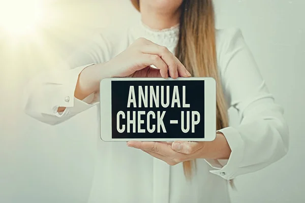 Text sign showing Annual Checkup. Conceptual photo yearly reproductive health visit with a health care provider Model displaying black screen modern smartphone mock-up for personal interest.