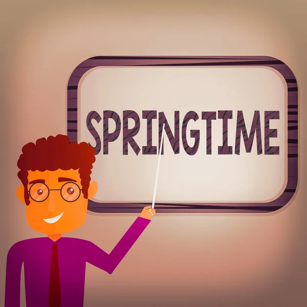 Writing note showing Springtime. Business photo showcasing season of the year during which the weather becomes warmer Man Standing Holding Stick Pointing to Wall Mounted Blank Color Board. — Stock Photo, Image