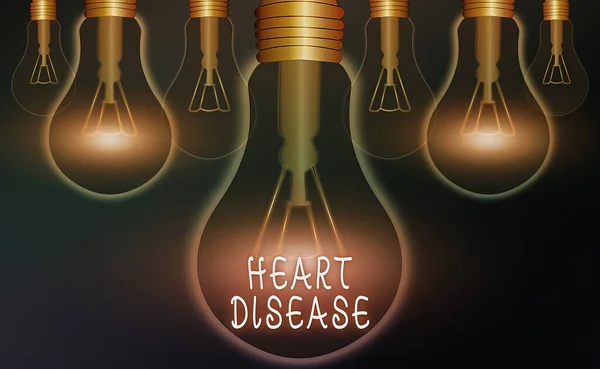 Word writing text Heart Disease. Business concept for A type of disease that affects the heart or blood vessels Realistic colored vintage light bulbs, idea sign solution thinking concept. — Stock Photo, Image
