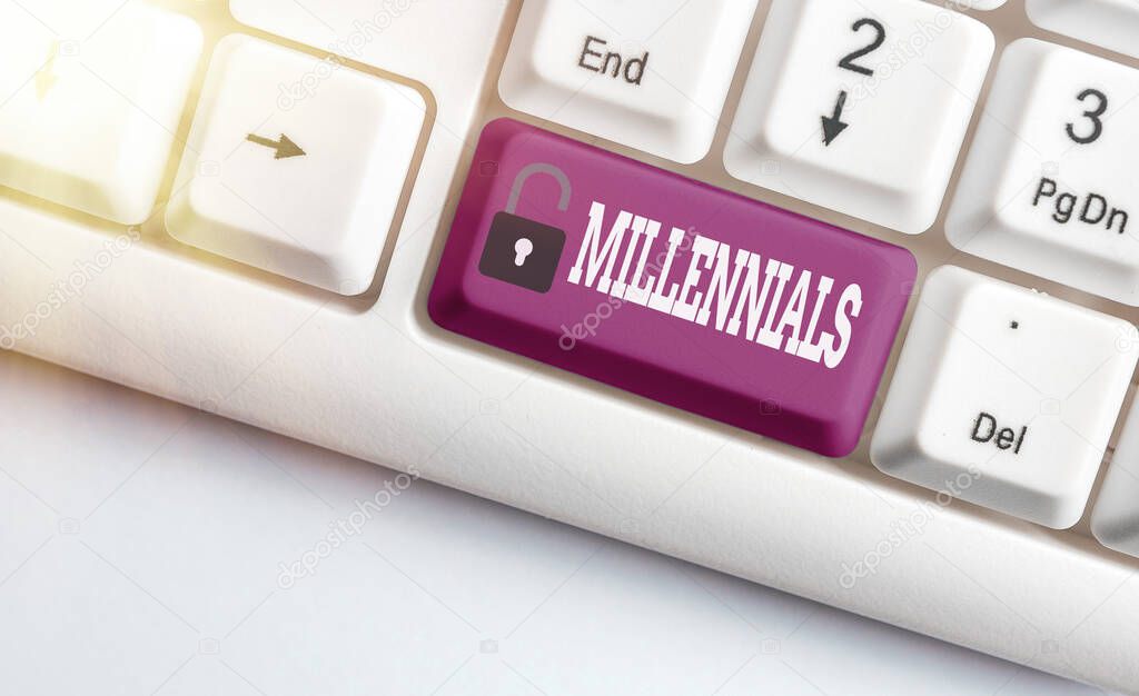 Word writing text Millennials. Business concept for an individual reaching young adulthood in the early 21st century Different colored keyboard key with accessories arranged on empty copy space.