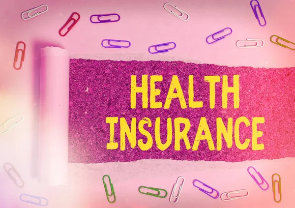 Word writing text Health Insurance. Business concept for system of financing the medical expenses of the insured Rolled ripped torn cardboard placed above a wooden classic table backdrop.
