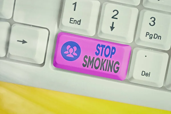 Conceptual hand writing showing Stop Smoking. Business photo showcasing the process of discontinuing or quitting tobacco smoking Colored keyboard key with accessories arranged on copy space. — Stock Photo, Image
