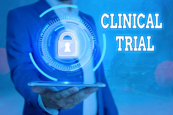 Handwriting text Clinical Trial. Concept meaning evaluate the effectiveness and safety of medications Graphics padlock for web data information security application system.