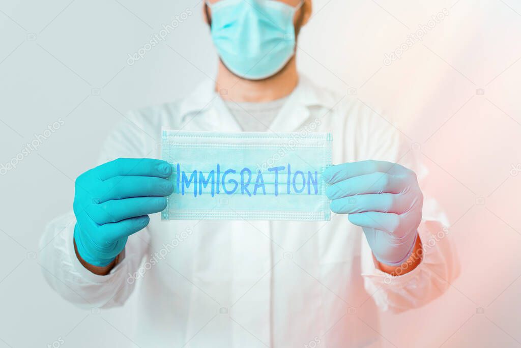 Writing note showing Immigration. Business photo showcasing the action of coming to live permanently in a foreign country Laboratory Technician Featuring Sticker Paper Smartphone.