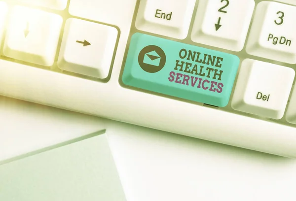 Conceptual hand writing showing Online Health Services. Business photo text healthcare delivered and enhanced through the internet Colored keyboard key with accessories arranged on empty copy space. — Stock Photo, Image