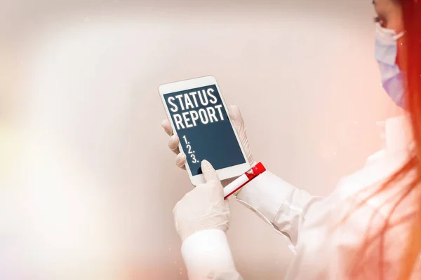 Text sign showing Status Report. Conceptual photo summarizes the particular situation as of a stated period Extracted blood sample vial with lastest technology ready for examination.