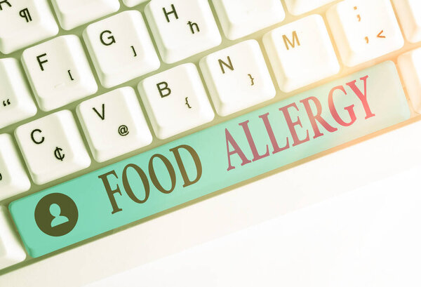 Writing note showing Food Allergy. Business photo showcasing abnormal immune system response to allergen after eaten Colored keyboard key with accessories arranged on empty copy space.