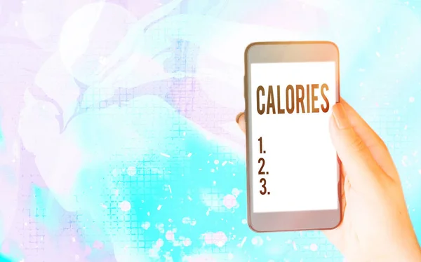 Word writing text Calories. Business concept for an amount of food having a value of the energy of one large calorie Modern gadgets with white display screen under colorful bokeh background. — Stock Photo, Image