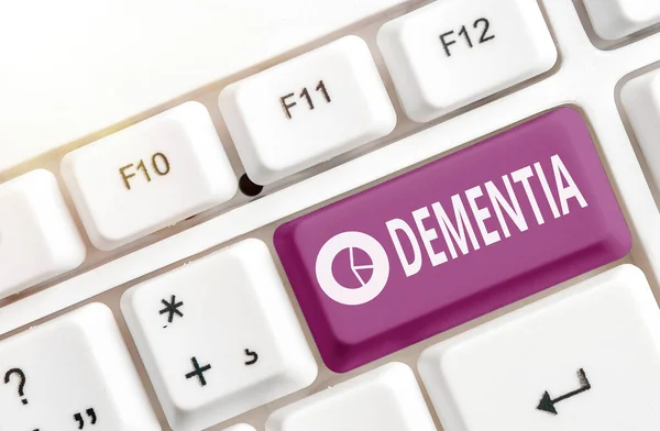 Text sign showing Dementia. Conceptual photo usually, a progressive condition marked by multiple deficits Different colored keyboard key with accessories arranged on empty copy space. — Stock Photo, Image
